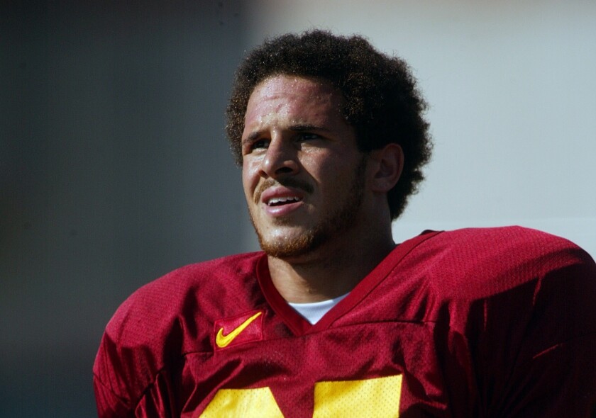 051972.SP.0829.tailbacks.AG -- USC running back Justin Fargas takes a break during practice Thursday on the campus football field.