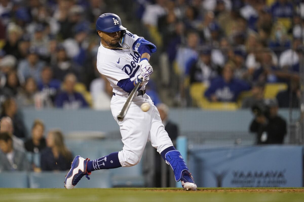 Dodgers right fielder Mookie Betts grounds into a double play against the Reds on Thursday.