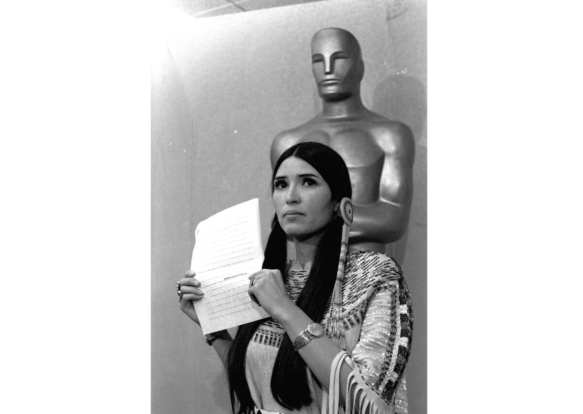 Sacheen Littlefeather holding speech at Academy Awards