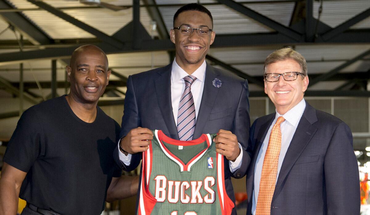 Less than a week after landing Duke's Jabari Parker, center, with the No. 1 draft pick, Bucks Coach Larry Drew, left, was out of job when General Manager John Hammond, right, and new ownership negotiated to bring in Jason Kidd as coach.