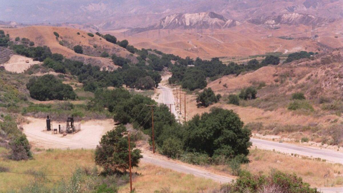 The L.A. County Board of Supervisors on Tuesday approved the first two subdivisions of the long-delayed Newhall Ranch development. Above, an area of the Santa Clarita Valley where the development is planned as it appeared in 1994.
