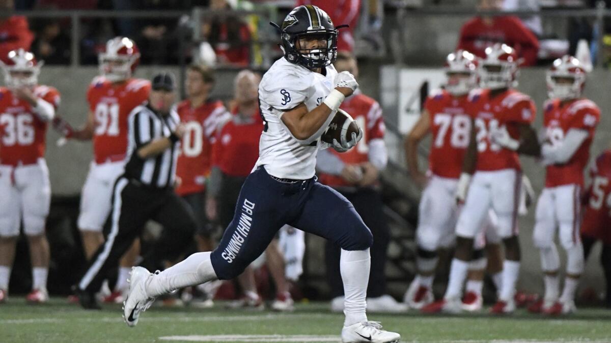 St. John Bosco running back George Holani breaks through the Mater Dei defense for a long touchdown run in the second half.