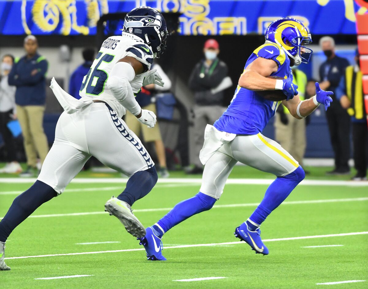 Rams wide receiver Cooper Kupp outruns Seahawks linebacker Jordyn Brooks on a touchdown reception.