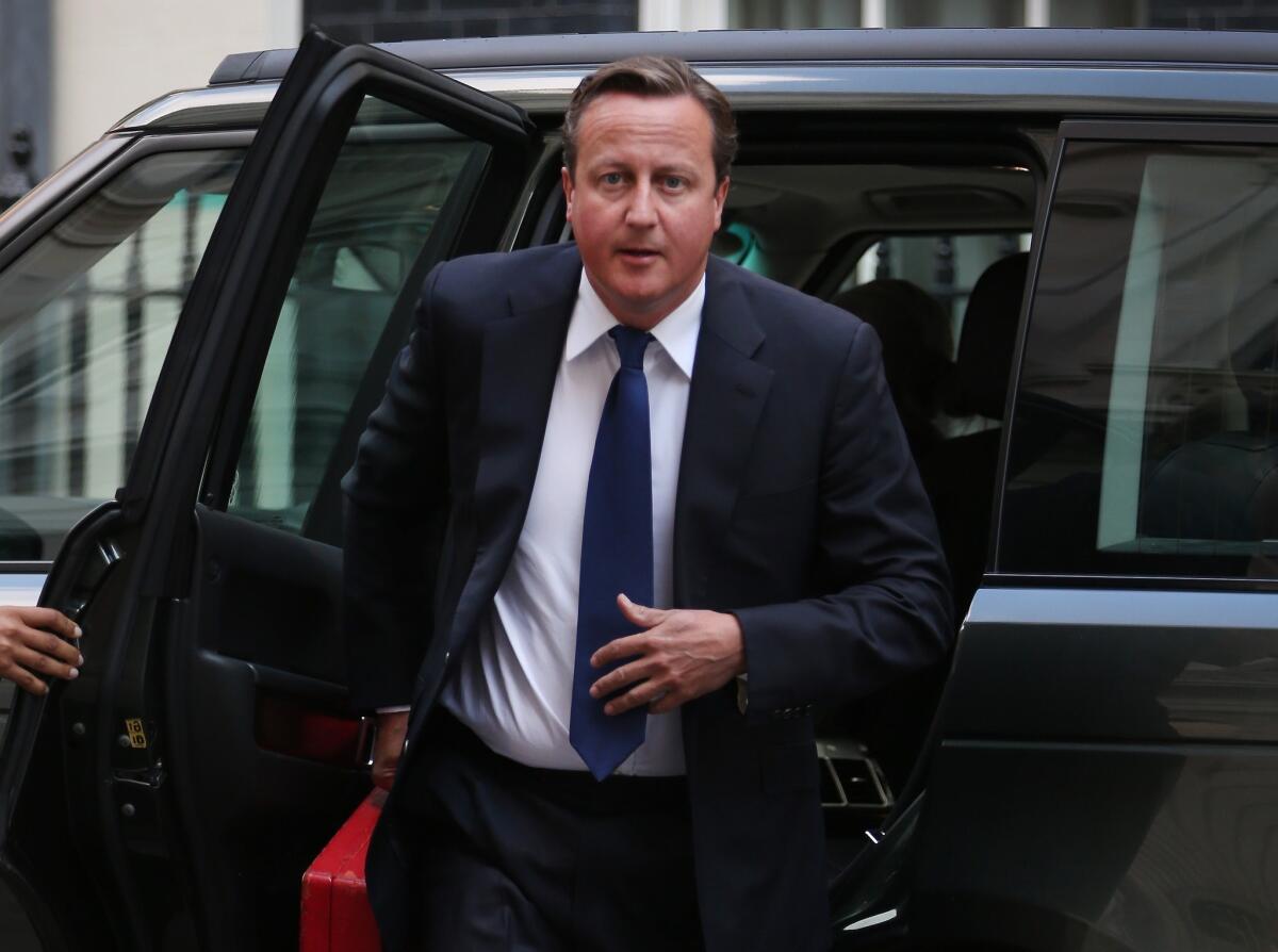British Prime Minister David Cameron arrives at 10 Downing Street. Cameron returned early from his holiday to address the escalating crisis in Syria.