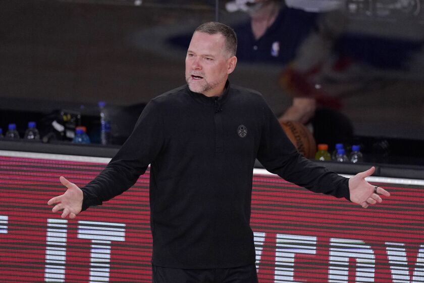 Denver Nuggets head coach Michael Malone gestures in the first half of an NBA conference semifinal playoff basketball game Thursday, Sept 3, 2020, in Lake Buena Vista Fla. (AP Photo/Mark J. Terrill)