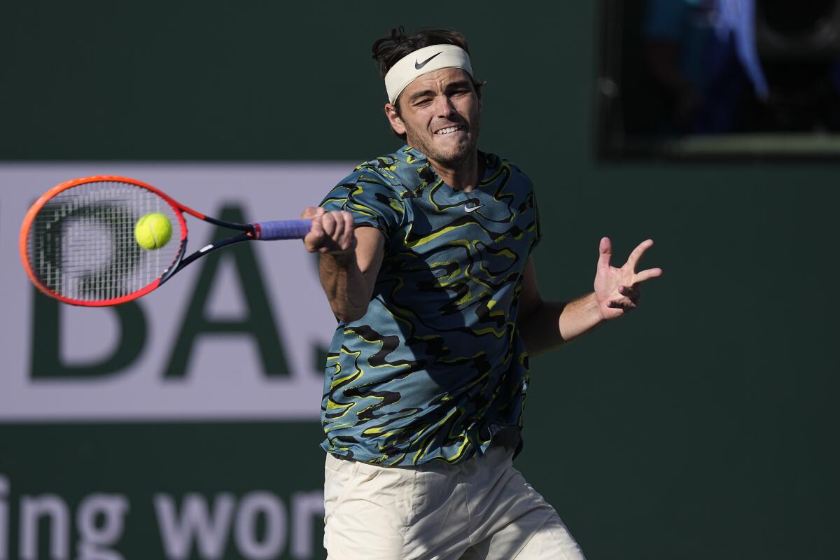 Taylor Fritz hits a return during his third-round victory over Sebastian Baez at the BNP Paribas Open in Indian Wells.