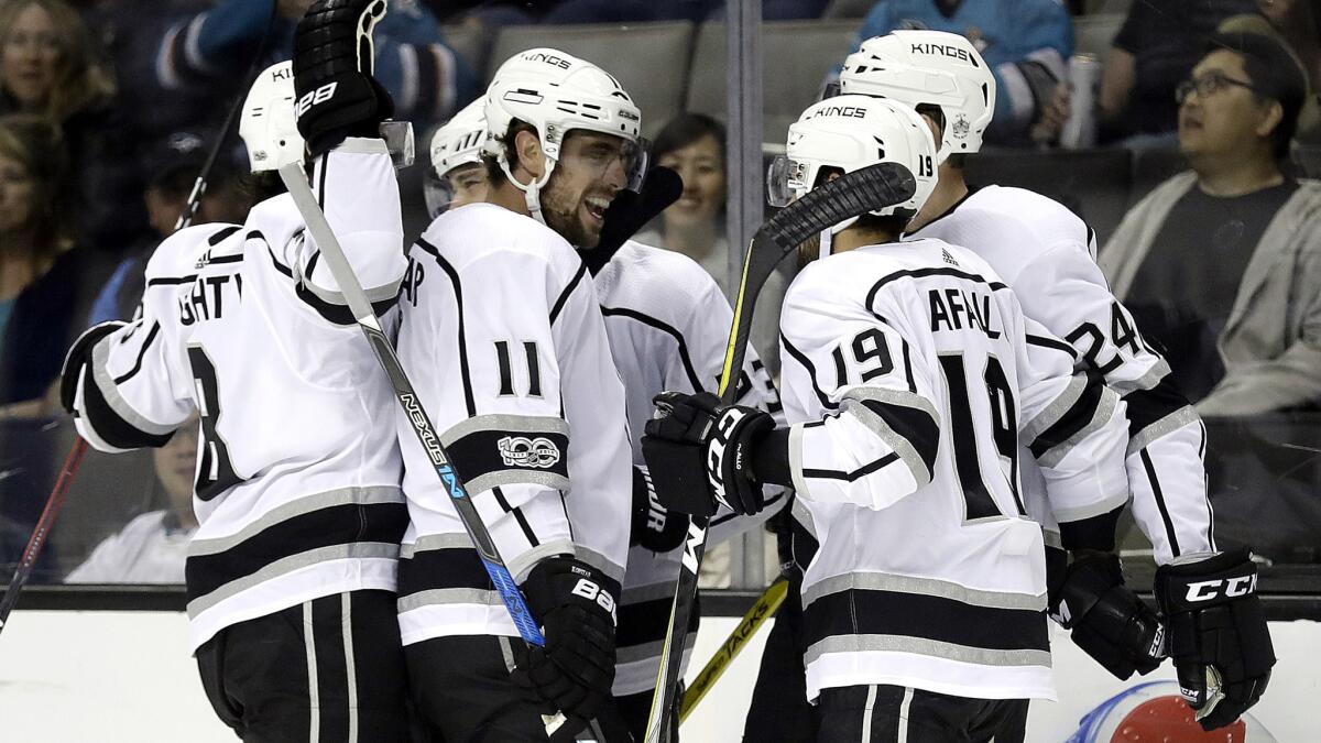 The Los Angeles Kings celebrate a goal by Dustin Brown during the first period of Saturday's game against the San Jose Sharks. The Kings won 4-1.
