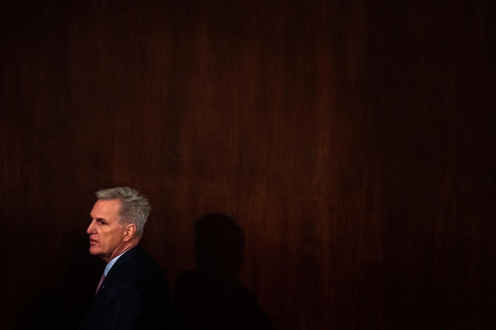 Rep. Kevin McCarthy walks around the floor of the House chamber at the U.S. Capitol.