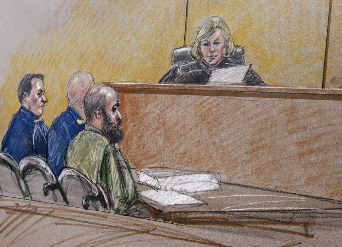 In a courtroom sketch of a pretrial hearing, Maj. Nidal Hasan, right, sits by his former defense attorneys, Maj. Joseph Marcee, far left, and Lt. Col. Kris Poppe, center, with the judge in the case, Col. Tara Osborn, behind the bench,