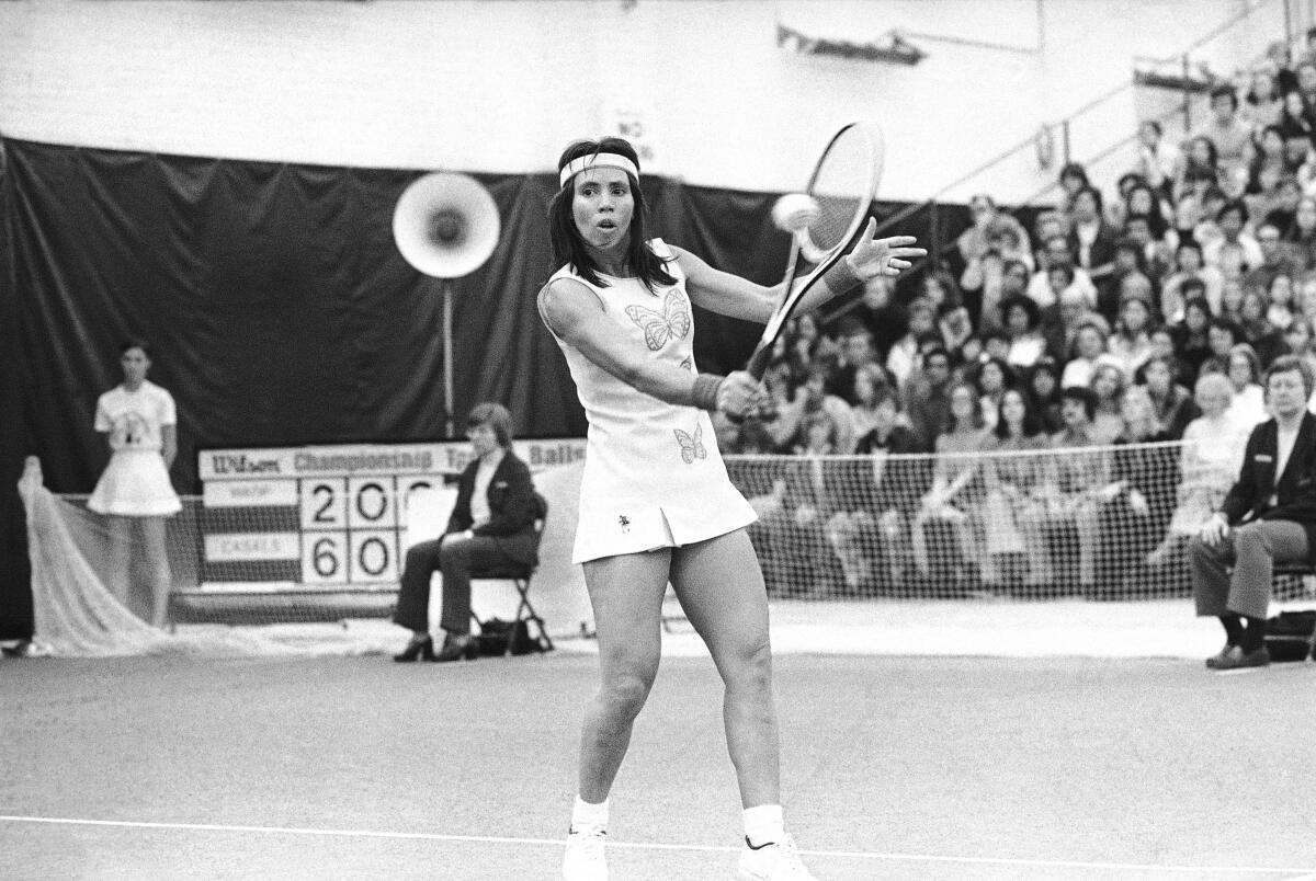 Rosie Casals returns shot by Virginia Wade during a Virginia Slims event on March 3, 1974, in Chicago.