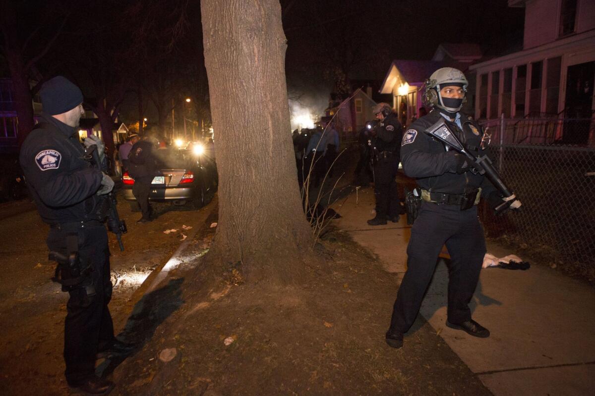 Police respond on Nov. 23 to the scene where five demonstrators were shot. The demonstrators were protesting the fatal shooting of a black man on Nov. 15 by a Minneapolis police officer.