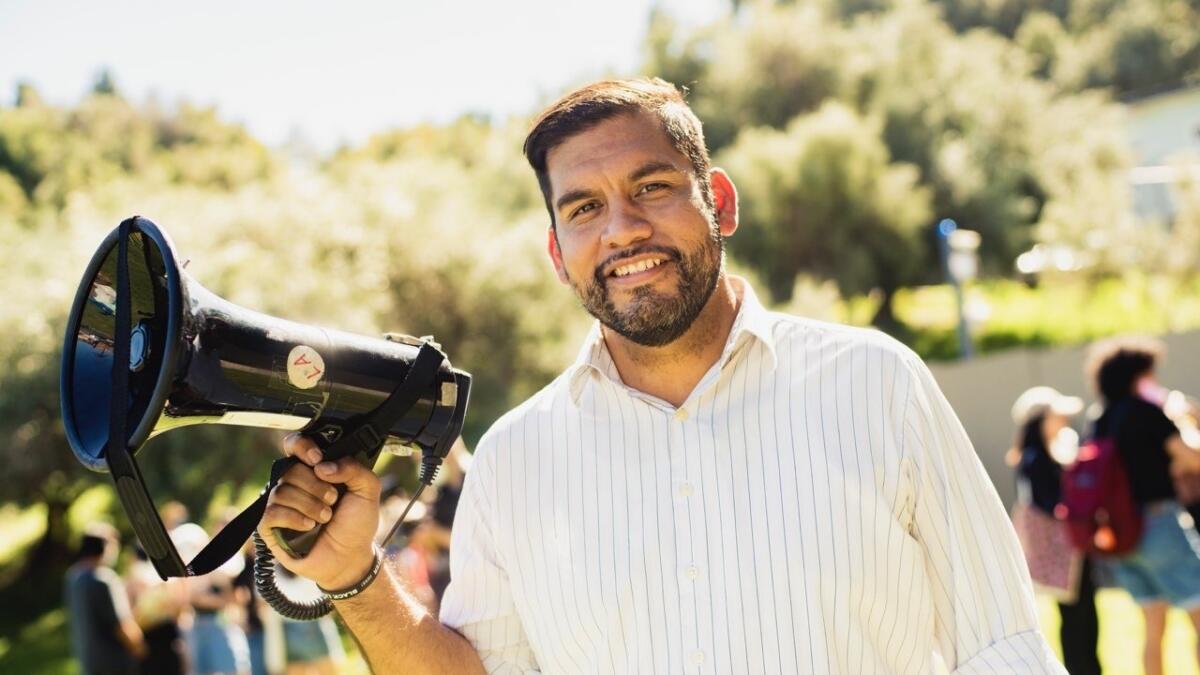 A man holding a bullhorn