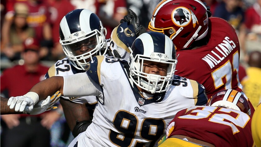 Rams defensive lineman Aaron Donald closes in on Redskins running back Samaje Perine in the fourth quarter.