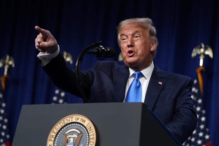 President Donald Trump speaks on stage as he visits the Republican National Committee convention site, Monday, Aug. 24, 2020, in Charlotte. (AP Photo/Evan Vucci)