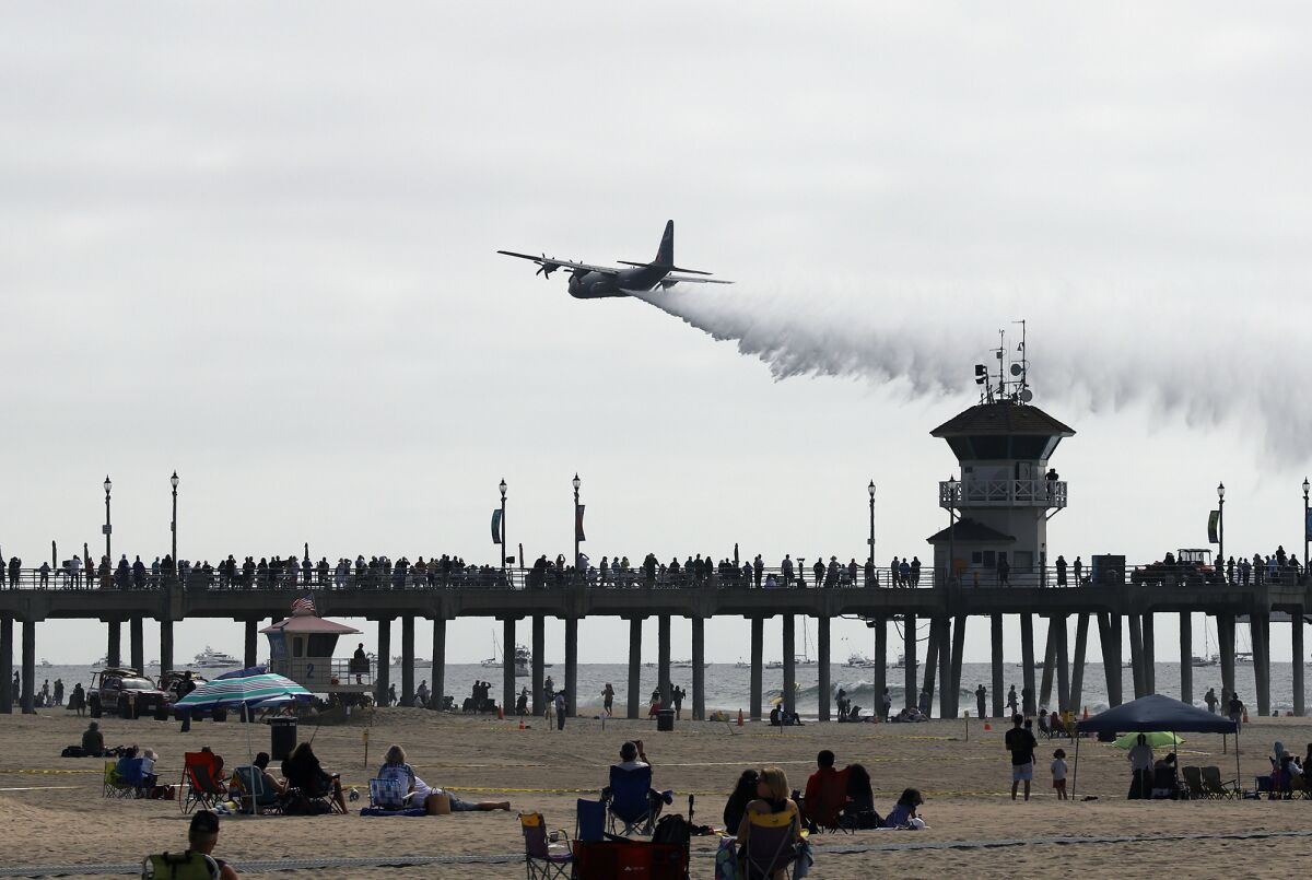 Spectators crowd the Huntington Beach Pier Friday morning to watch the opening ceremonies of the Pacific Airshow.