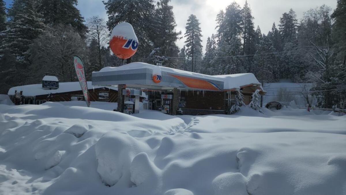 Snow covers a Union 76 gas station in Lake Arrowhead after a brutal winter storm blanketed the area.