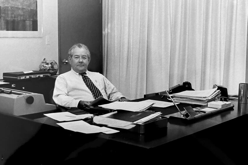 Undated image of Ignacio Lozano Jr. at his desk.