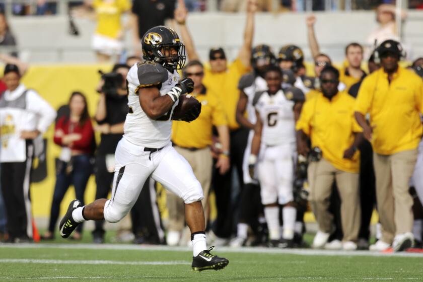 Missouri TB Russell Hansbrough takes on a long run for a touchdown against Minnesota during the Buffalo Wild Wings Citrus Bowl in Orlando on January 1, 2015. Missouri won the game 33-17. (Jacob Langston/Orlando Sentinel)