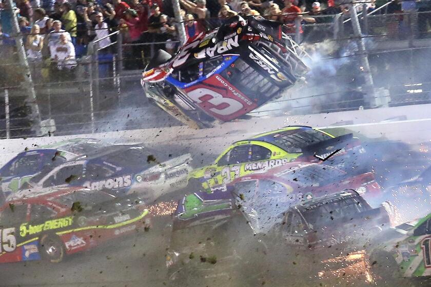 Austin Dillon (3) goes upside down as he crashes in a dramatic wreck during the Coke Zero 400 NASCAR Sprint Cup race at Daytona International Speedway on Sunday, July 5, 2015. (Stephen M. Dowell/Orlando Sentinel)
