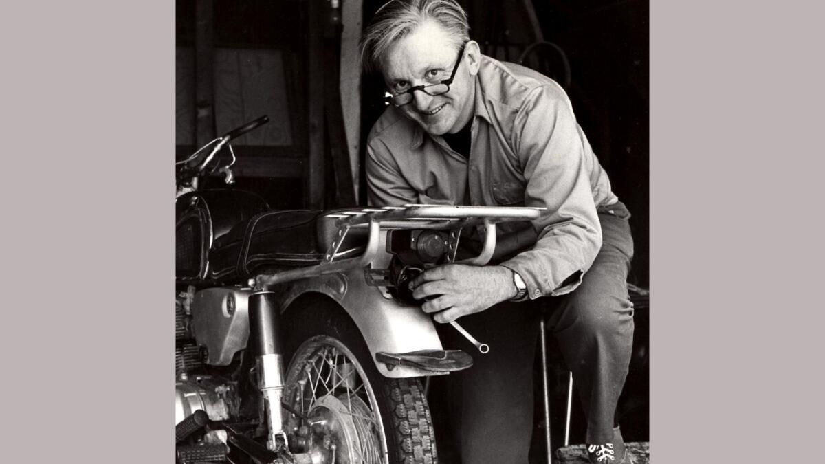Robert Pirsig working on a motorcycle in 1975.