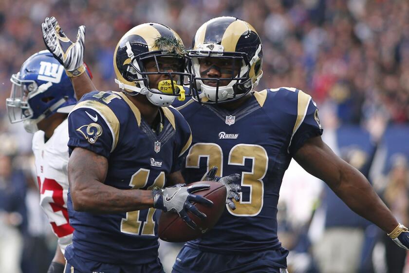The Rams' Tavon Austin, left, celebrates his touchdown with teammate Benjamin Cunningham during the NFL International Series game between Los Angeles and the New York Giants on Sunday in London.