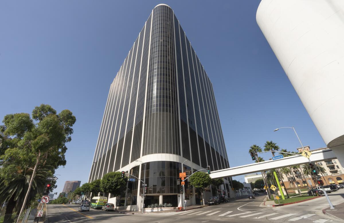 A tall, mostly glass-fronted office tower 