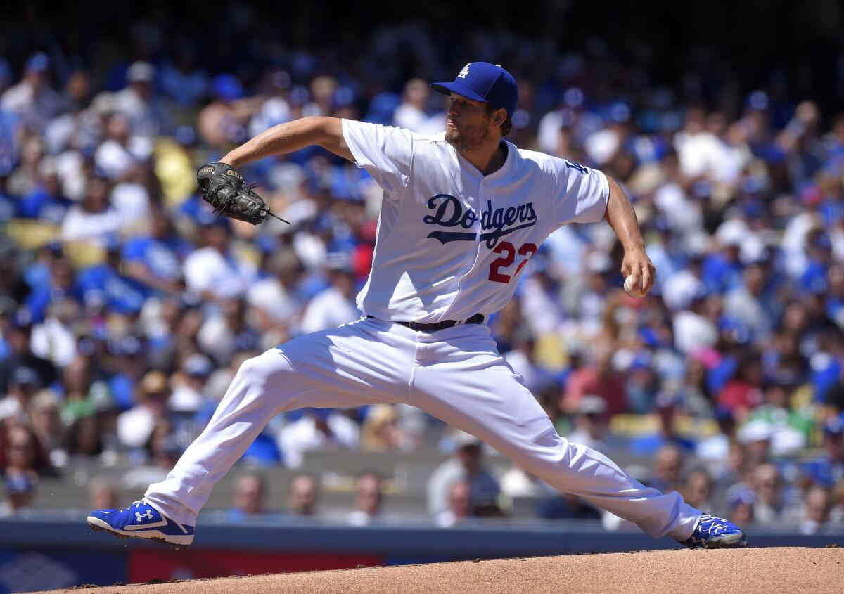 Clayton Kershaw delivers a pitch during the first inning of the Dodgers' opening day game against the San Diego Padres on Monday at Dodger Stadium.