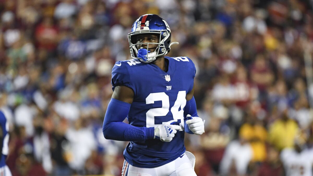 New York Giants cornerback James Bradberry (24) looks on between plays during the second half of an NFL football game against the Washington Football Team, Sept. 16, 2021, in Landover, Md. The Giants have released Bradberry. A starter for the team the last two seasons, including making the Pro Bowl in 2020, Bradberry is a salary cap casualty. He was due for a $21.9 million cap hit, so cutting him Monday, May 9, 2022 will save about $10 million. The team can designate him a post-June 1 release and save another $1.5 million on the cap for 2022. (AP Photo/Terrance Williams)