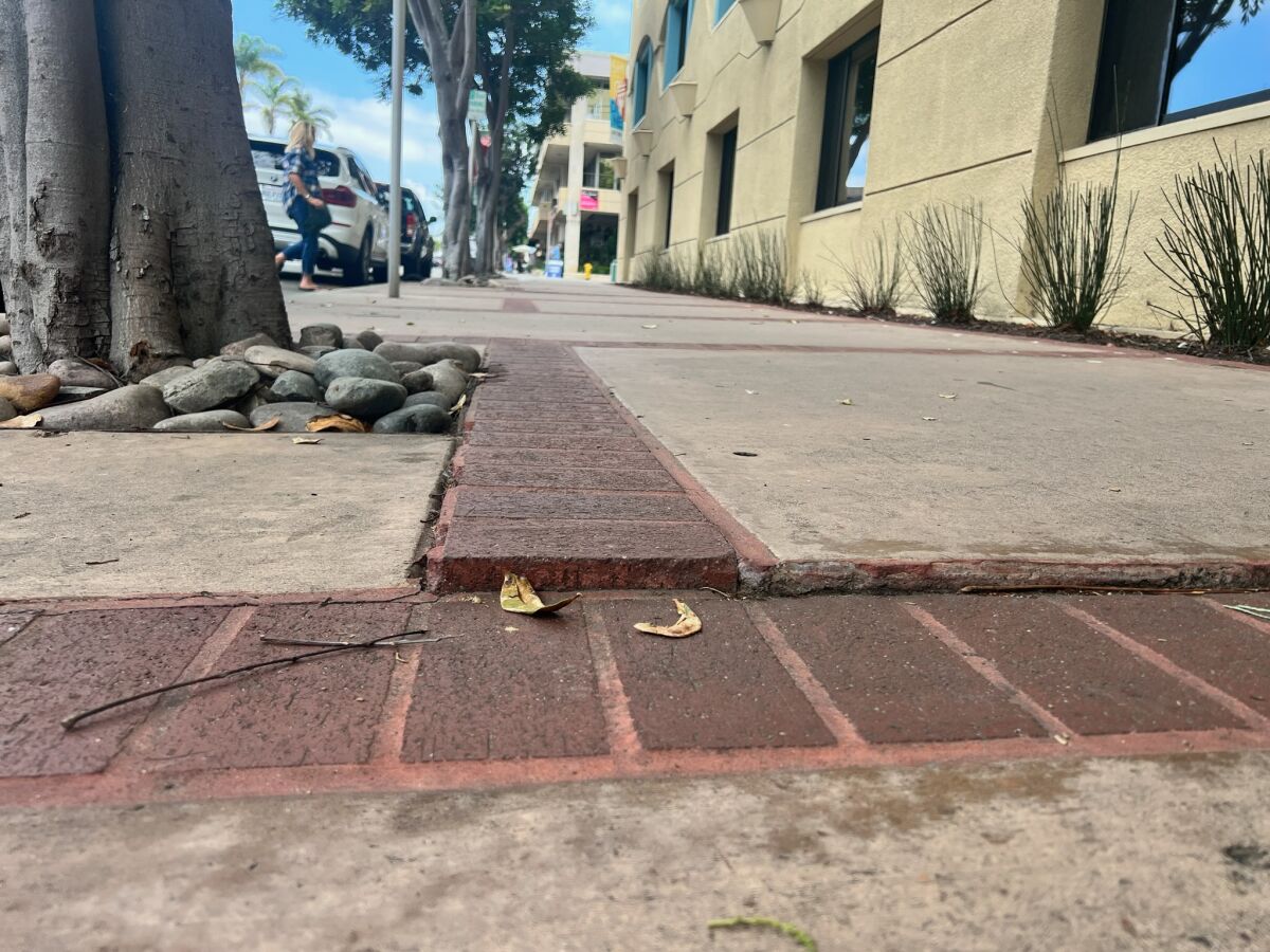 This raised concrete on Silverado Street is where a trip and fall reportedly occurred.
