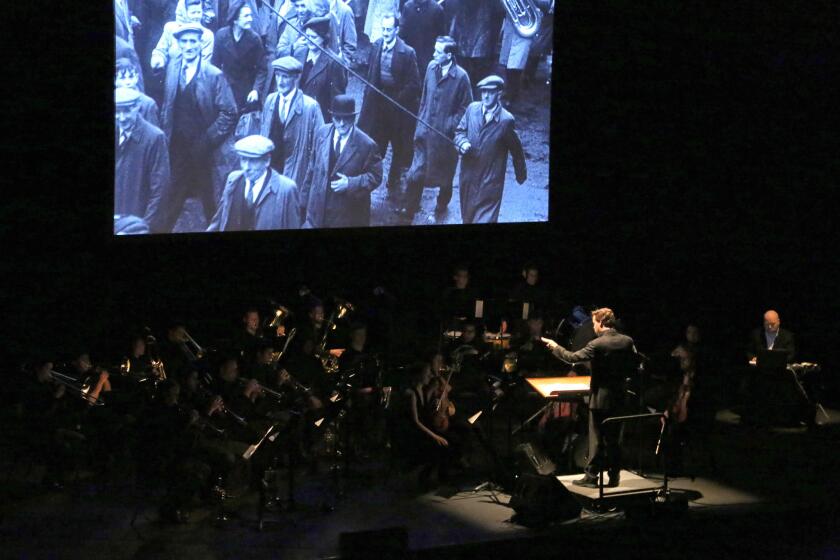 Bill Morrison's "The Miners' Hymns," a documentary about coal workers in northeast England last century, rolls as Ryan McAdams conducts the score at Royce Hall.