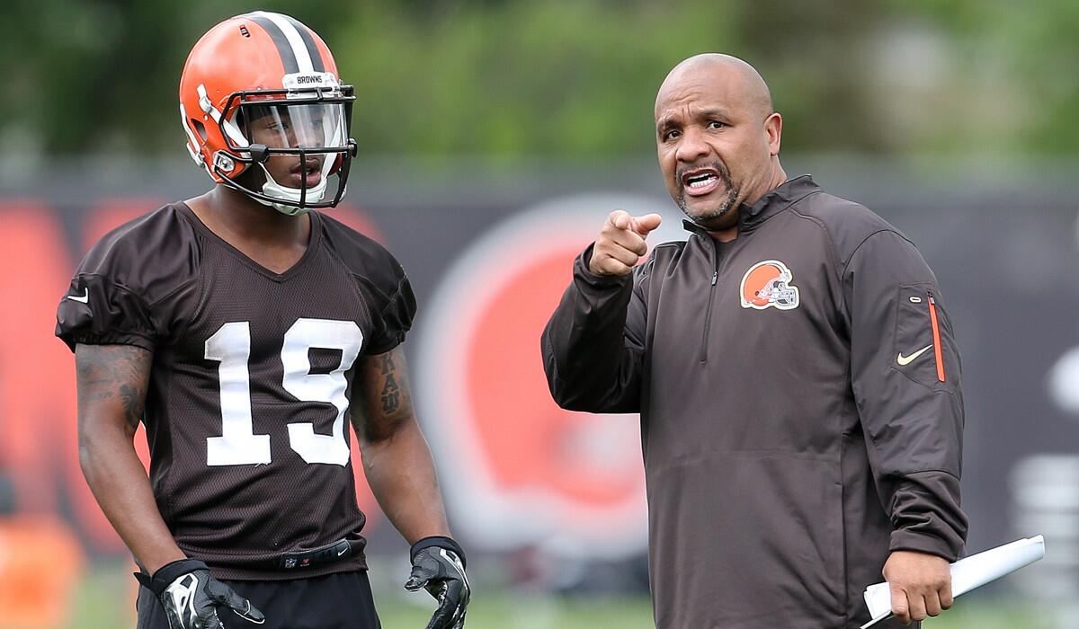 Cleveland Browns head coach Hue Jackson, right, gives directions to Browns wide receiver Corey Coleman during mini camp on June 7.