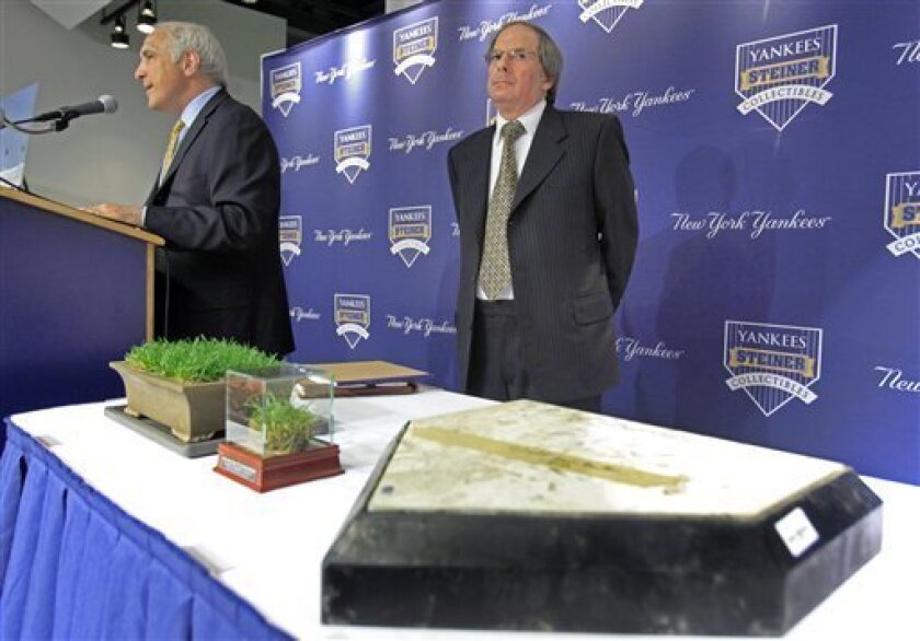 Brandon Steiner, left, chairman of Steiner Sports Marketing, and New York Yankees chief operating officer Lonn Trost participate in a news conference in New York, Tuesday, May 12, 2009, announcing the sale of memorabilia from the old Yankee Stadium. (AP Photo/Richard Drew)