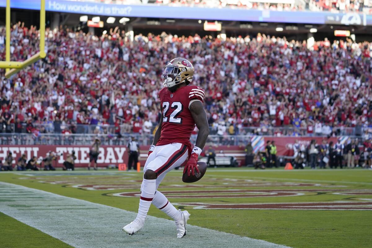 San Francisco 49ers running back Jeff Wilson Jr. celebrates after scoring on a 32-yard touchdown run.