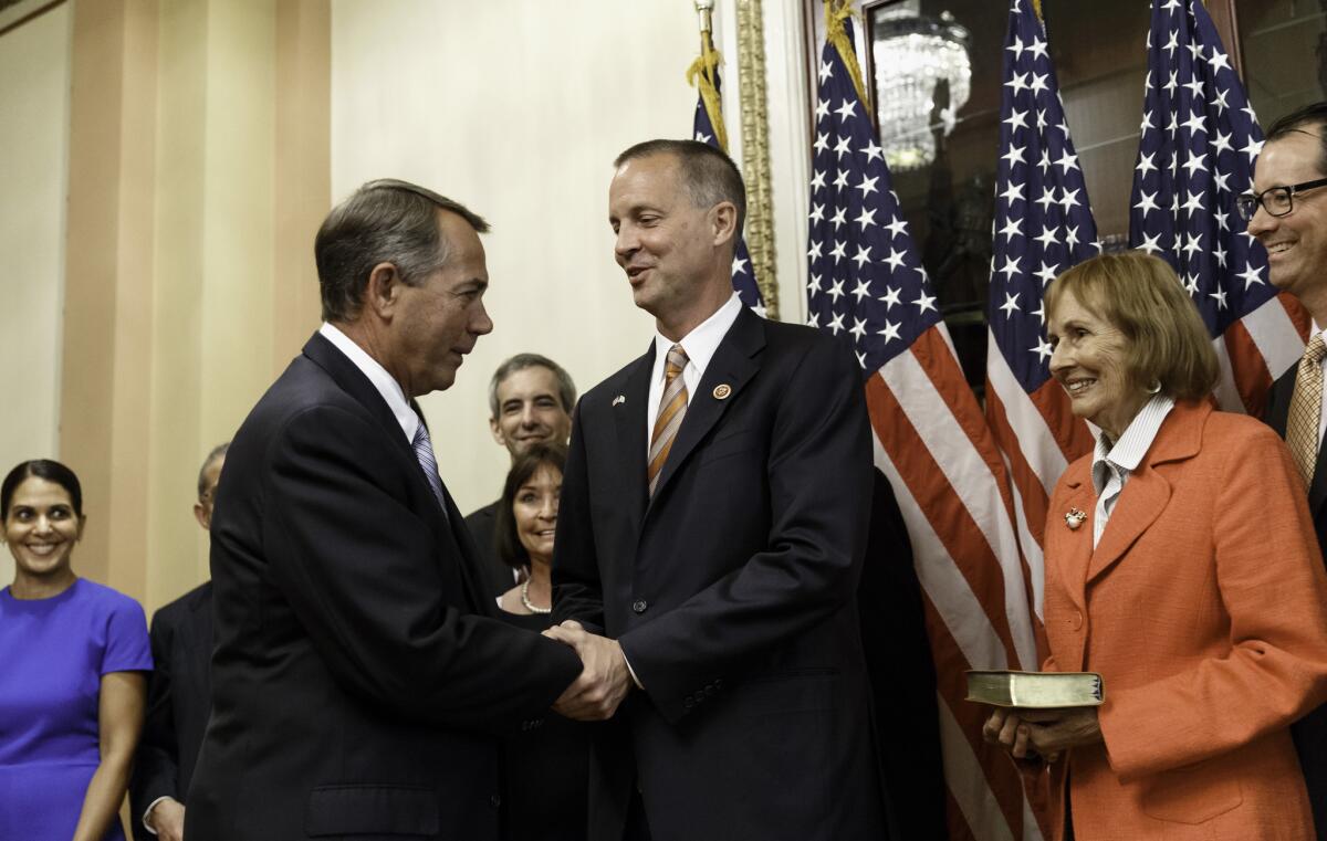 House Speaker John Boehner, left, greets Rep. Curt Clawson (R-Fla.) in June after Clawson won a special election to replace Rep. Trey Radel.