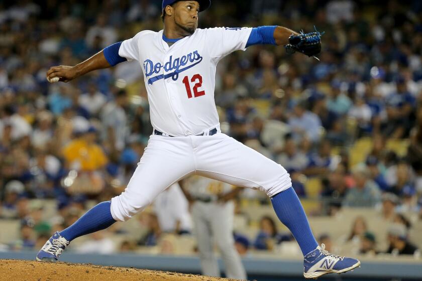 Dodgers reliever Juan Nicasio pitches against the Athletics on July 29 at Dodger Stadium.