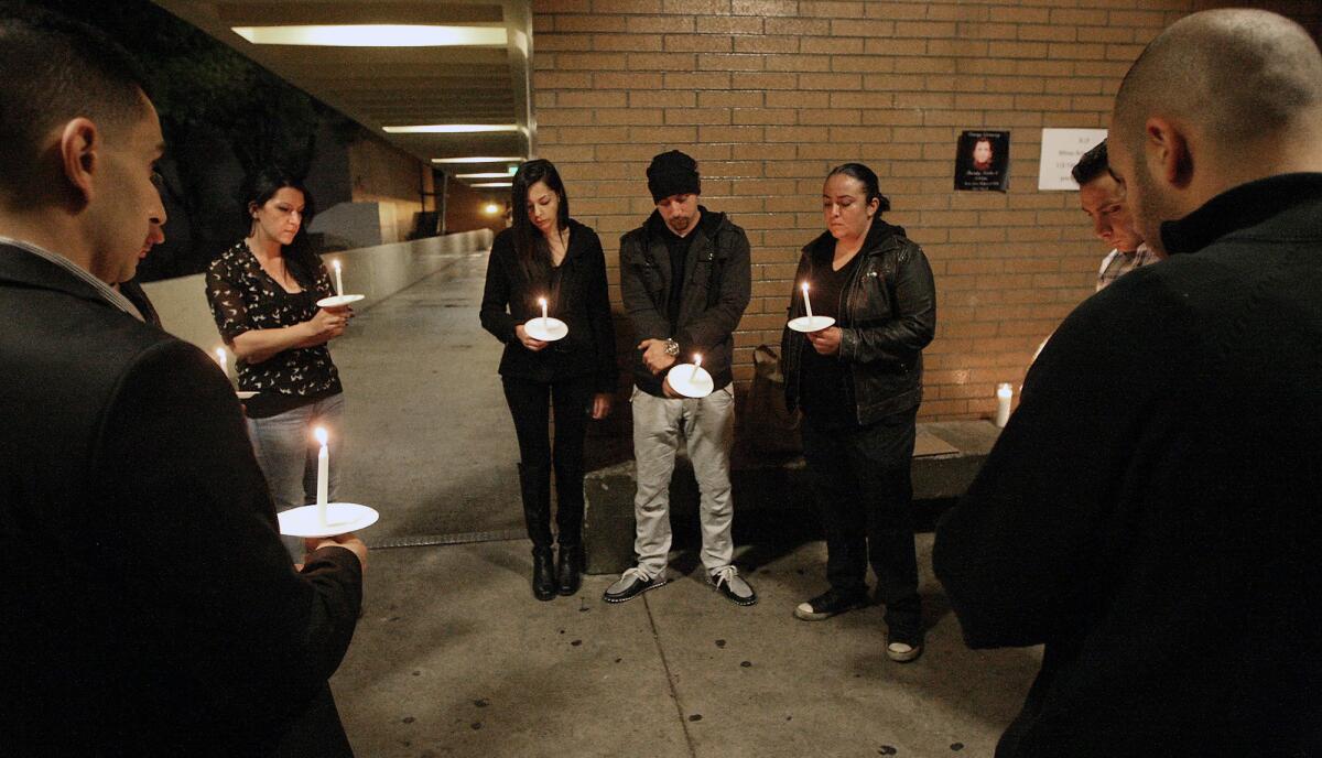 Friends and family gather for a candle vigil at Glendale High on Monday, October 5, 2105 in memory of Minas Arutyunyan after he died following a stabbing recently.