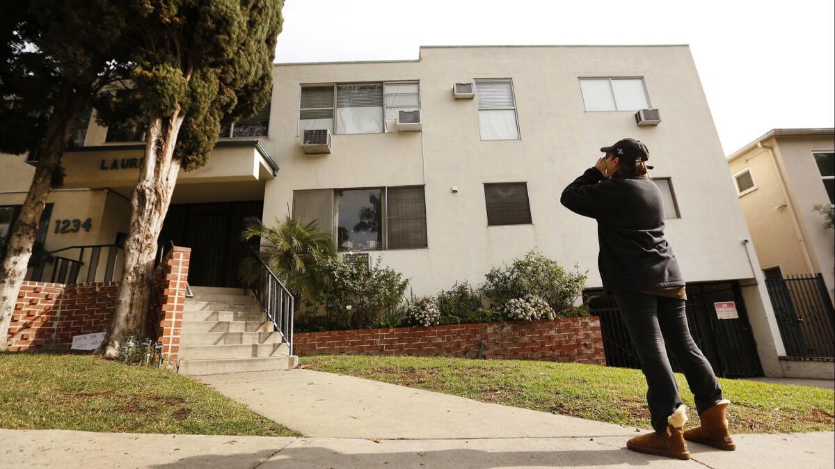 Neighbor Jackie Tepper, yells at the second floor corner unit