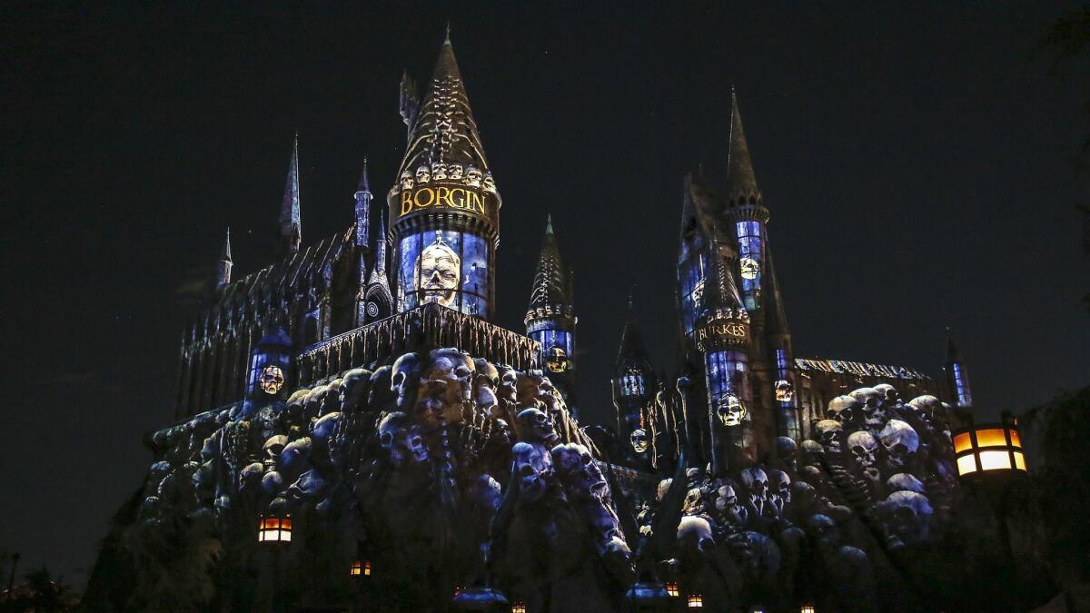 The "Dark Arts at Hogwarts" light show depicts a battle between the boy wizard Harry Potter and the followers of Lord Voldemort. The show takes place nightly through April 28.