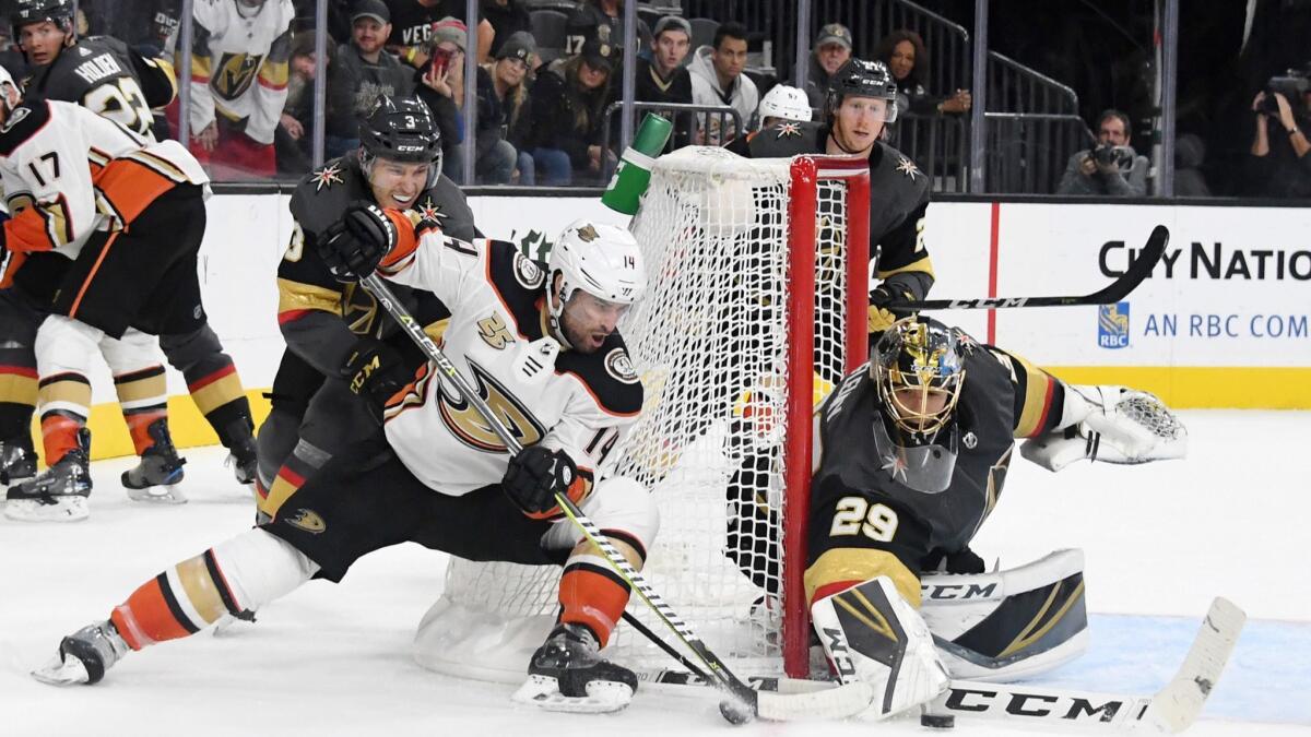 Marc-Andre Fleury (29) of the Vegas Golden Knights blocks a shot by Adam Henrique (14) of the Anaheim Ducks in the third period.