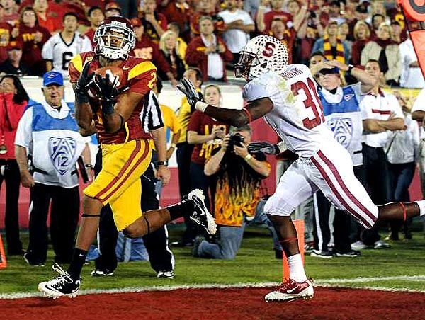 USC receiver Robert Woods catches a touchdown pass behind Stanford cornerback Barry Browning in the second overtime at the Coliseum on Saturday night.