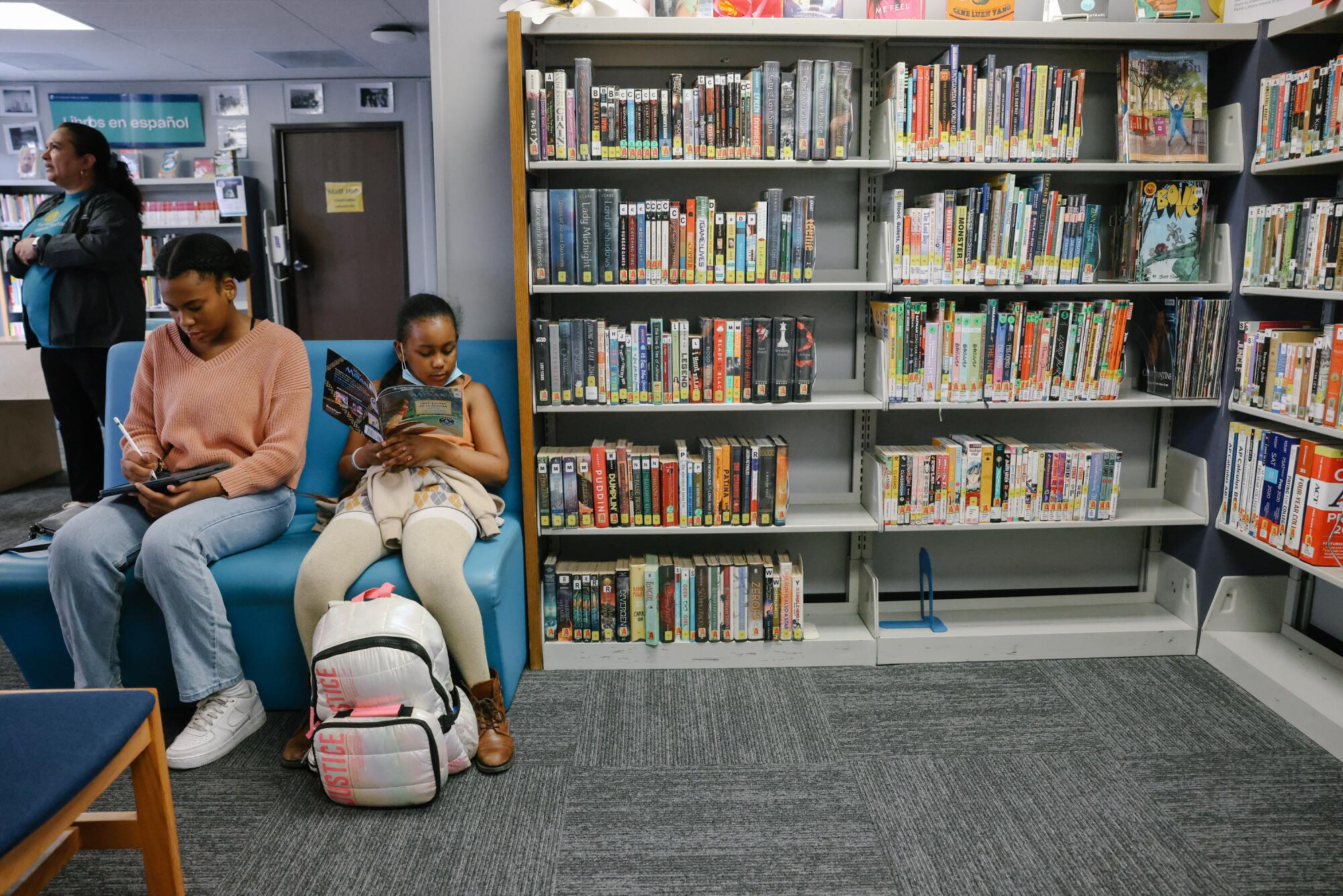 People utilize the space at the temporary home of the Ben Franklin Branch on Wednesday, May 3, 2023 in Los Angeles, CA. 