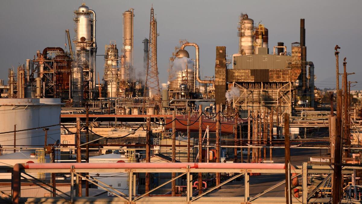 EPA inspectors who visited a former Exxon Mobil refinery in Torrance found hazardous materials that California inspectors had not ordered removed, raising questions about whether states are equipped to pick up enforcement responsibilities the EPA is dropping.