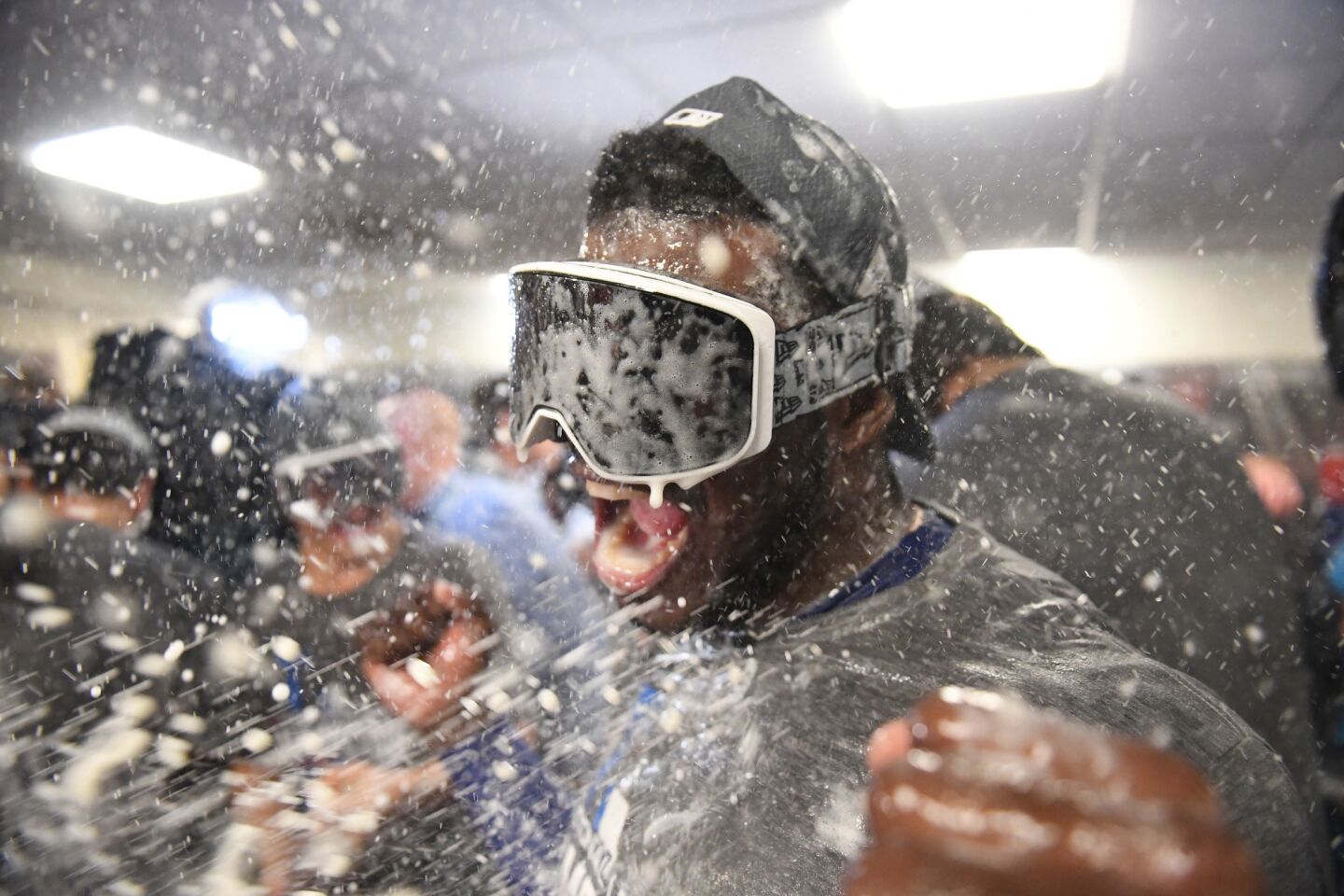 Dodgers Yasiel Puig celebrates in locker room after Dodgers defeated Brewers 5-1.