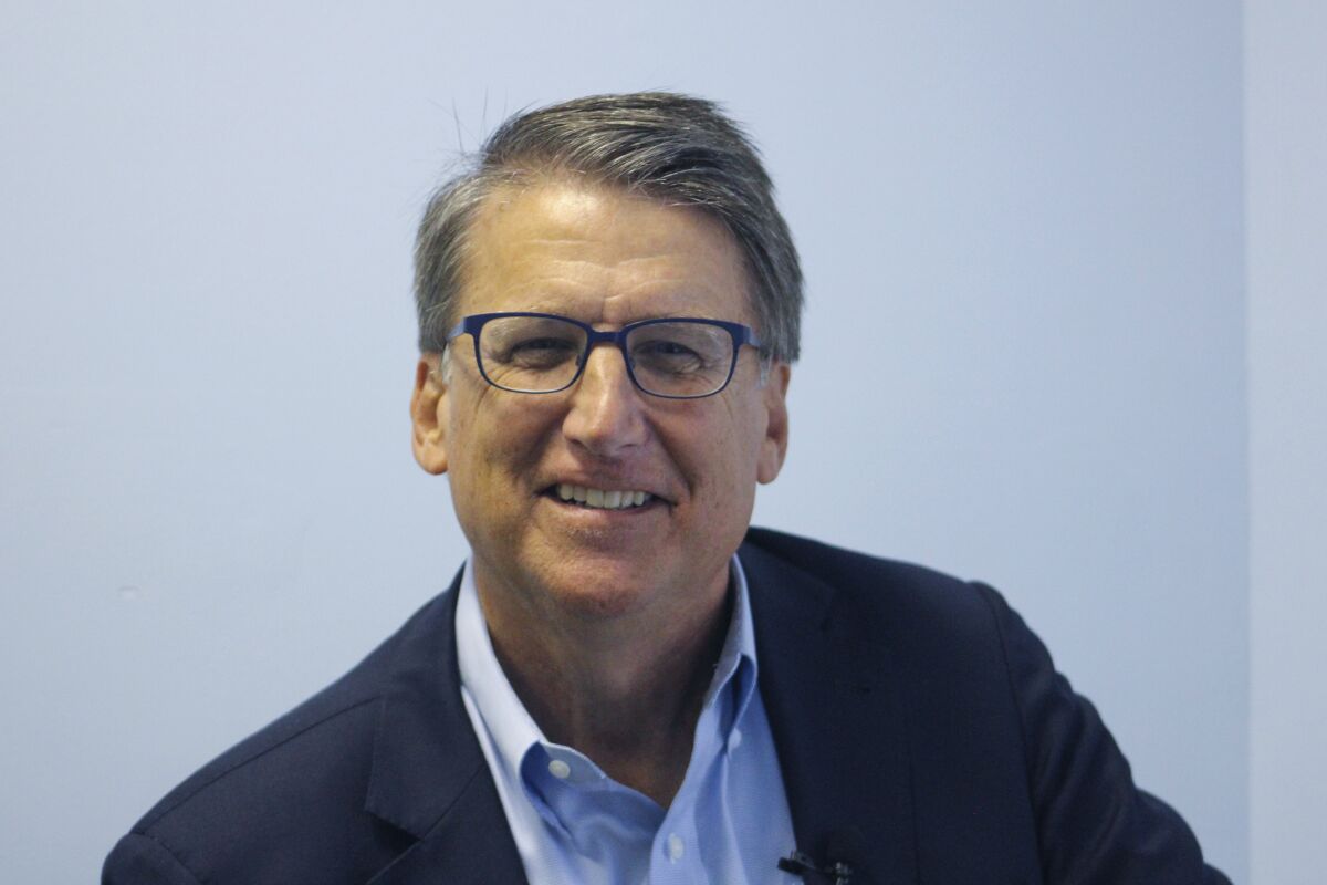 FILE - In this Sept. 25, 2021, photo former North Carolina Gov. Pat McCrory, who is seeking the Republican nomination for the U.S. Senate poses for a photo an event in Mount Airy, N.C. McCrory and ex-Rep. Mark Walker are urging Rep. Ted Budd, R-N.C., to agree to participate in a U.S. Senate debate. (AP Photo/Bryan Anderson)