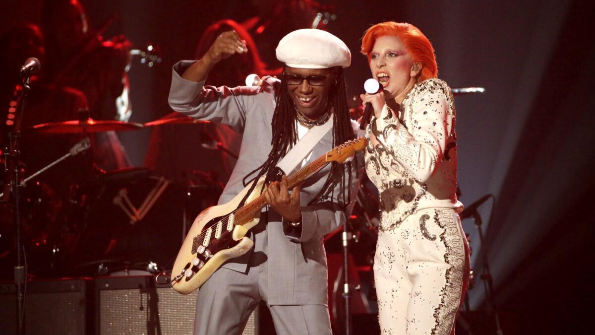 Lady Gaga performs her David Bowie tribute onstage with Nile Rodgers at the 58th Grammy Awards.