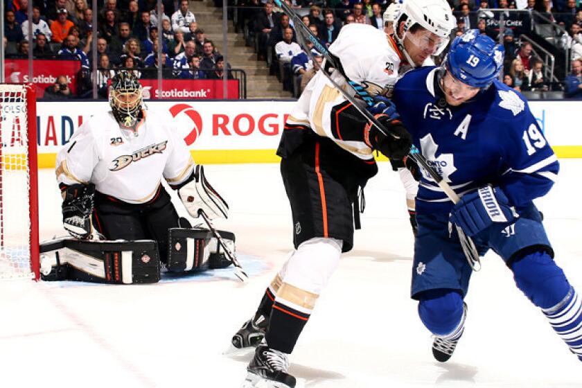 Ducks defenseman Luca Sbisa battles Joffrey Lupul for position during a game earlier this month.