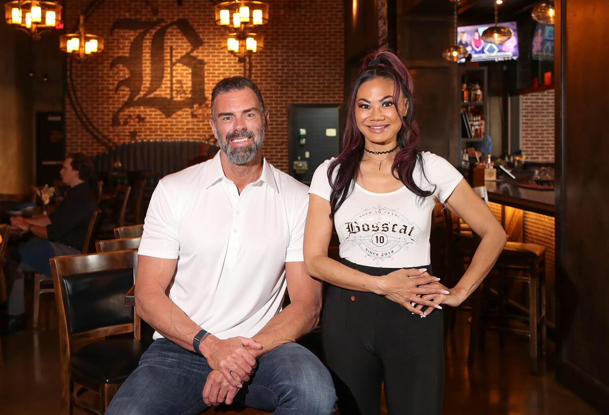 Founders John Reed and Leslie Nguyen in the dining room of Bosscat Kitchen & Libations in Irvine. 