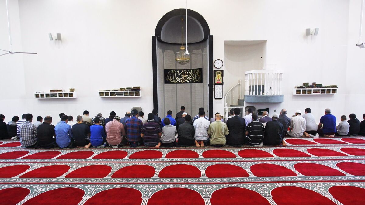 Worshipers pray during an afternoon prayer at the Islamic Center of San Diego.