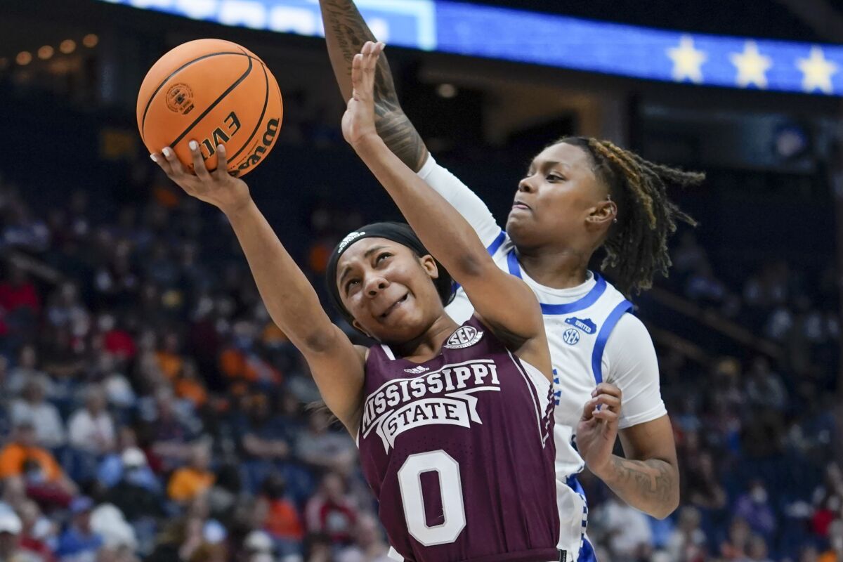Mississippi State's Anastasia Hayes (0) drives in front of Kentucky guard Jazmine Massengill, right, in the first half of an NCAA college basketball game at the women's Southeastern Conference tournament Thursday, March 3, 2022, in Nashville, Tenn. (AP Photo/Mark Humphrey)