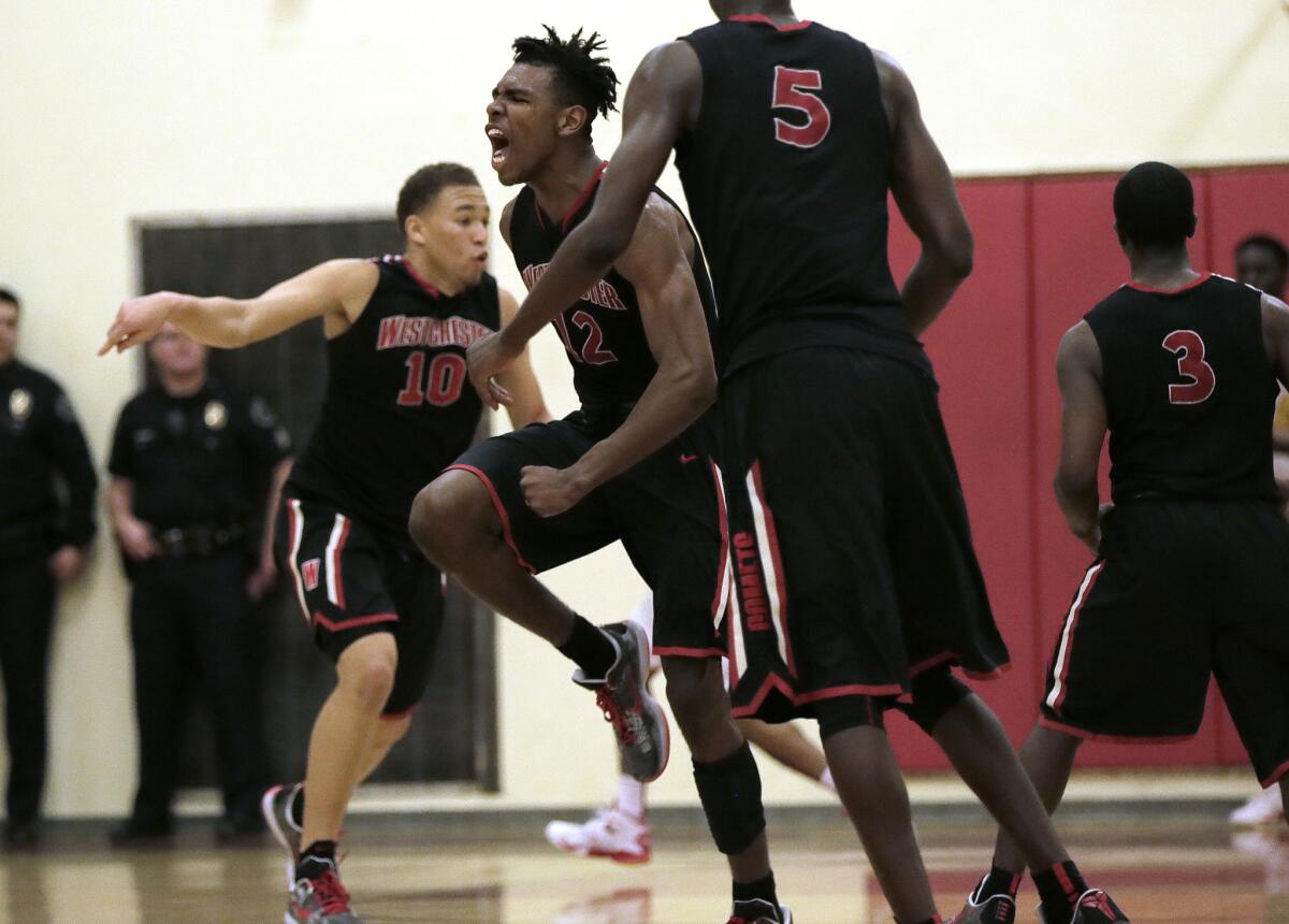 Westchester's Keith Fisher (12) reacts in the closing moments of his team's 53-47 win over Fairfax on Jan. 22.